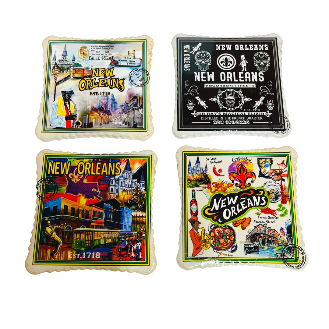 Four square coasters with New Orleans-themed designs on a white background
